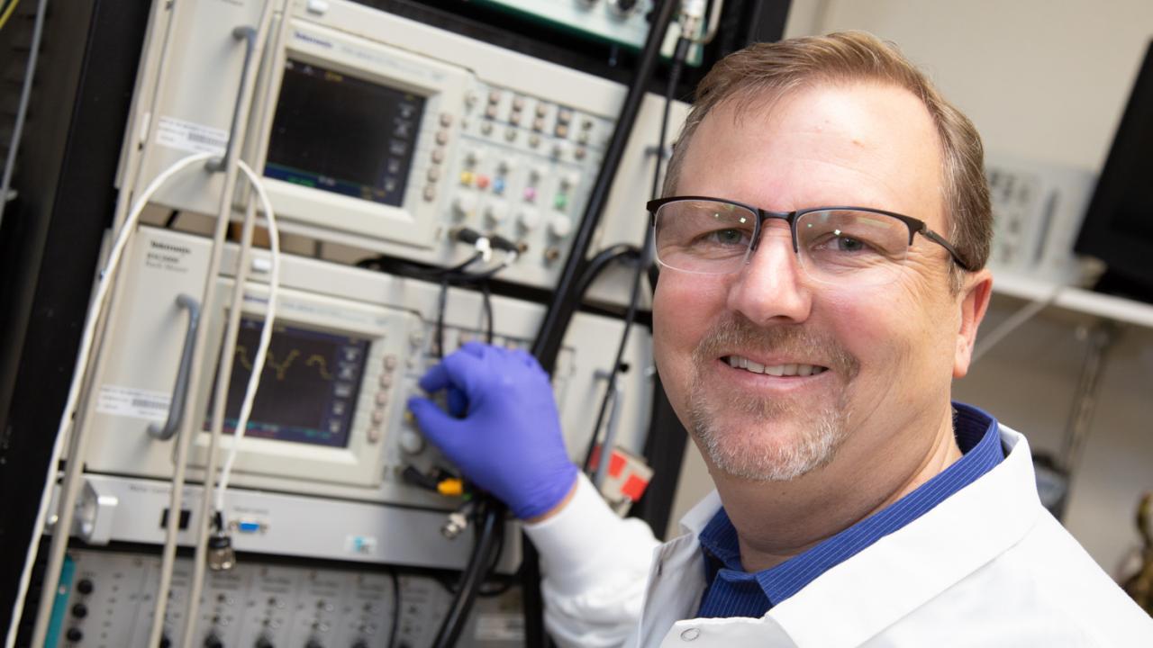 Marty in front of electrophysiology rig